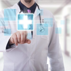 Male doctor working on a futuristic touchscreen display